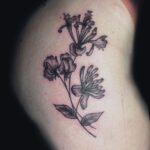 minimalist flower tattoo by brynn johnson