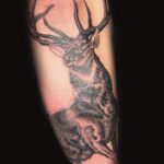 wild buck with antlers realism tattoo by donavan moore