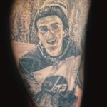 realism portrait tattoo of a young male hockey player wearing a jets jersey by donavan moore