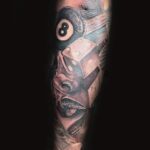 surrealism tattoo of womens face with dice and 8 ball by donavan moore