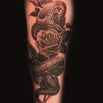 snake and rose sem realism tattoo by donavan moore