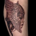 woman in winged helmet realism tattoo by vaeda russett