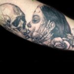 skull kissing woman realism tattoo by vaeda russett