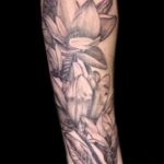 fine line flower tattoo by vaeda russett