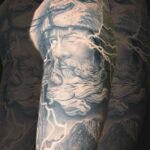 Realism tattoo of Zeus with lightening in his eyes by Donavan Moore in Kelowna, BC.
