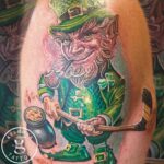 A whimsical new school tattoo of a mischievous Leprechaun holding a hockey stick by Donavan Moore.