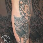 Black and grey realism tattoo of an owl by Donavan Moore.
