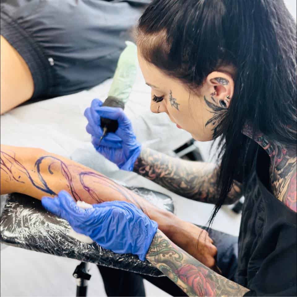 Akira tattooing a client in Kelowna.